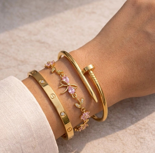 A Gen-Z aesthetic 3-piece anti-tarnish gold plated bracelet stack worn on a