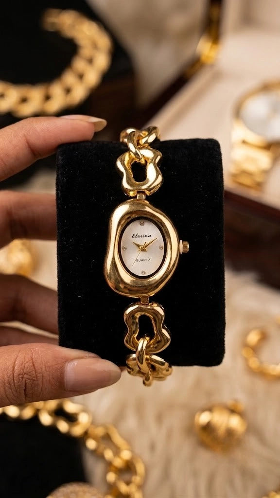 Moncheri Jewels anti-tarnish gold plated watch featuring a minimal wavy dial on a clean light background.
