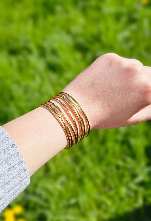 Back view showing the adjustable open cuff design of the bracelet