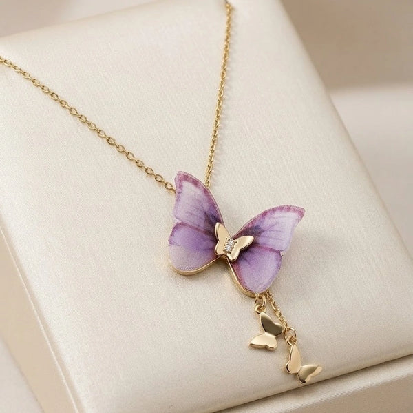 Detailed view of the gold-plated chain and purple butterfly wing texture