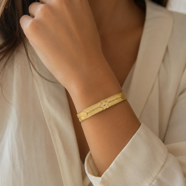 Flatlay presentation of anti tarnish floral bangle jewelry