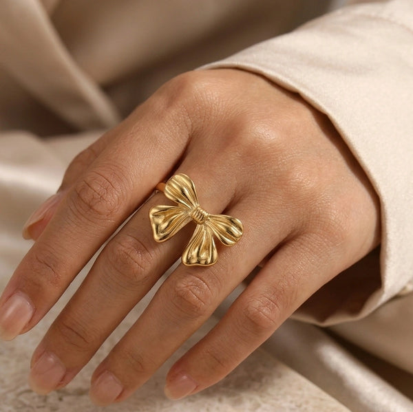 Front view of elegant anti-tarnish gold plated bow ring