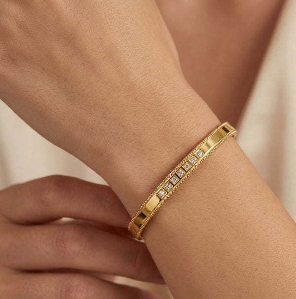 Front view of minimalist anti-tarnish gold-plated CZ bracelet on a woman's wrist