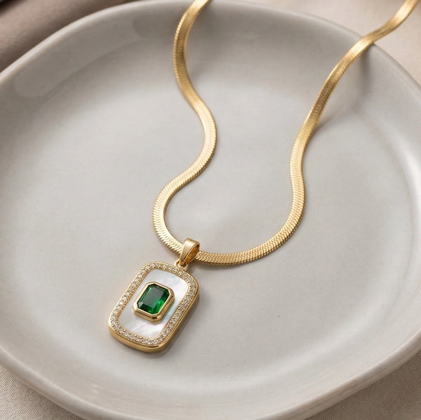 Detailed view of flat gold plated snake chain necklace