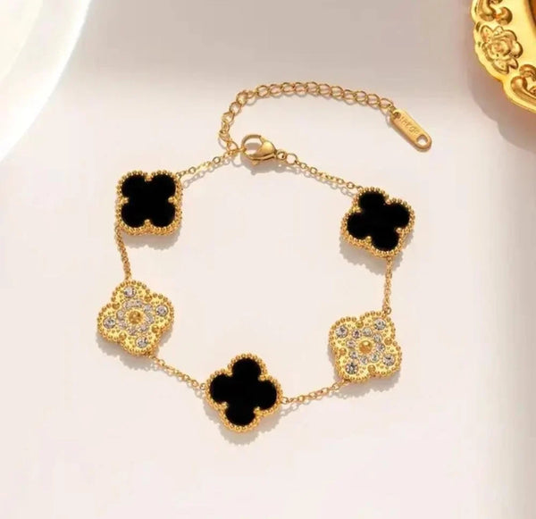 Main view of black and crystal clover anti-tarnish gold plated bracelet