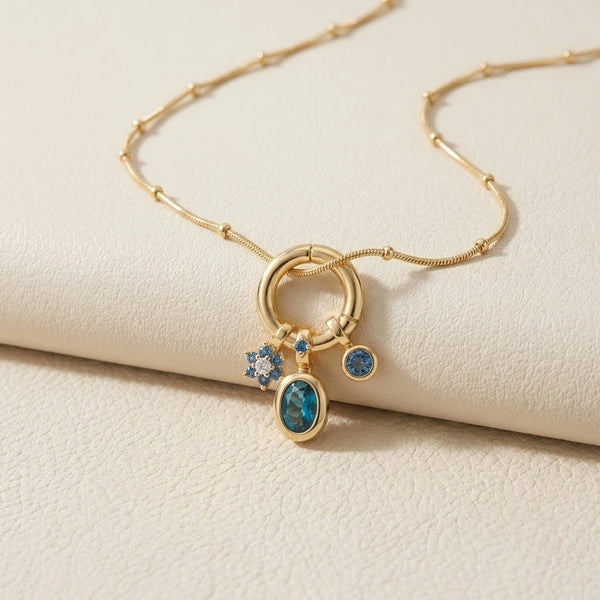 Front view of minimalist blue charm pendant anti-tarnish gold plated necklace