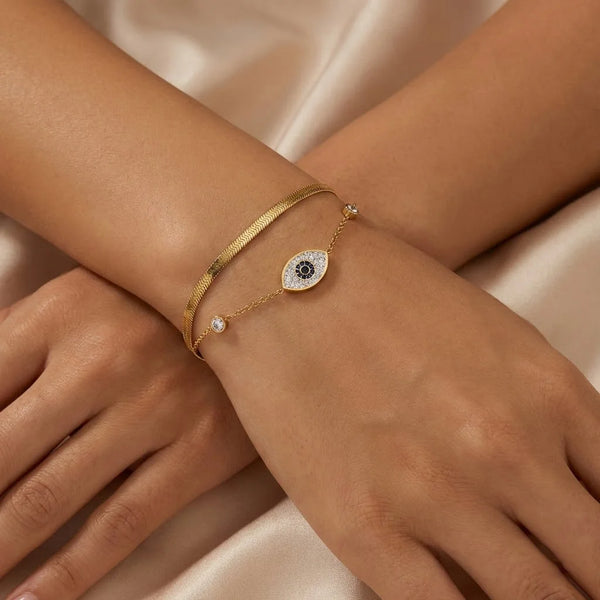 Blue stone eye bracelet for women with delicate gold plated chains and zirconia stones
