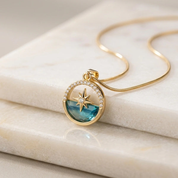 Detailed view of blue translucent stone and star design on anti tarnish pendant