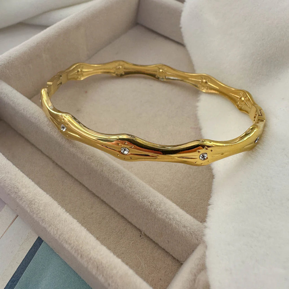 Crystal Studded Wavy Bangle - Anti-Tarnish Gold-Plated Bracelet