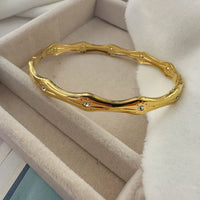 Crystal Studded Wavy Bangle - Anti-Tarnish Gold-Plated Bracelet