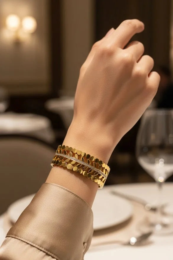 Close up of Cut Out Leaf Design Wide Cuff Bangle in Gold Plating