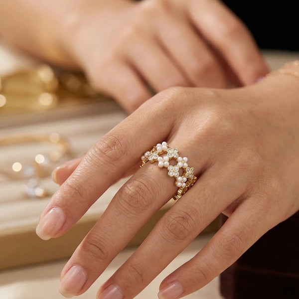 Close up details of pearls and crystals on open cuff flower ring