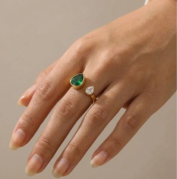 Model wearing emerald pear and diamond drop fashion ring