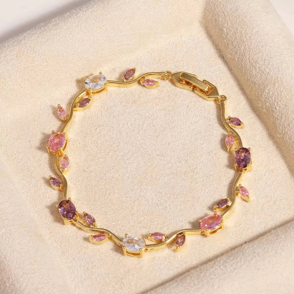 Front view of delicate floral vine pink and purple stone anti-tarnish bracelet