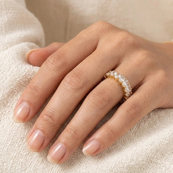 Gold crystal eternity fashion ring front view on hand