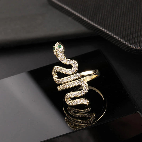 18K Gold plated snake ring with green crystal eyes and pave setting.