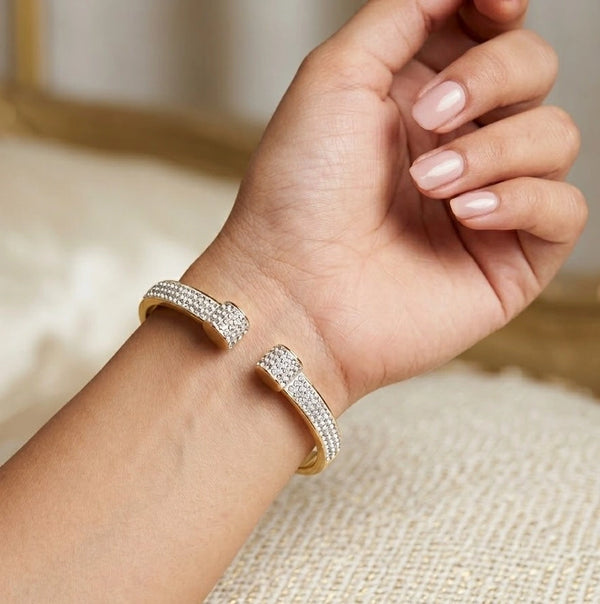 Woman wearing Gold-Tone Crystal Studded Open Cuff Bangle on Wrist