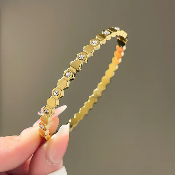 Front view of hexagon geometric anti-tarnish gold-plated bracelet with crystal studs