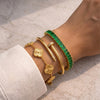 The "IT Girl" 3-Pc Iconic Gold Bracelet Stack: Clover, Nail & Emerald Tennis Set