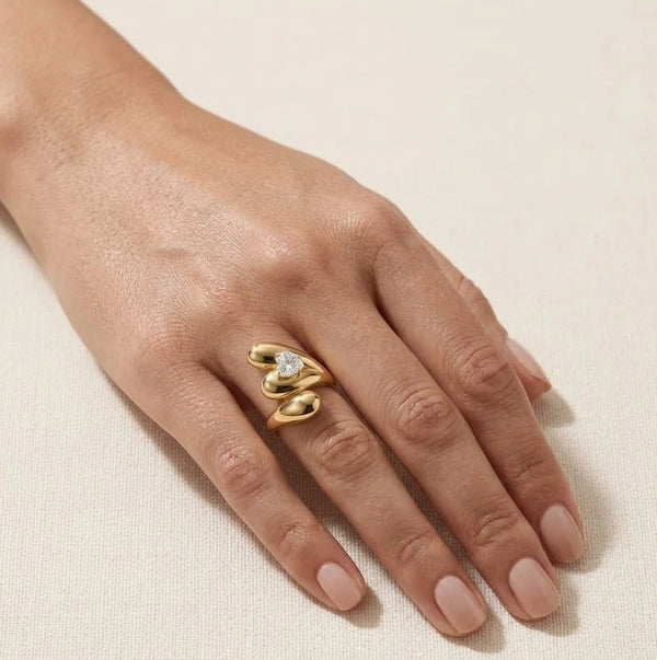 Woman wearing Korean chunky heart gold plated statement ring on hand