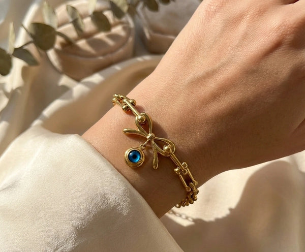 Woman wearing korean style dainty gold plated charm bracelet