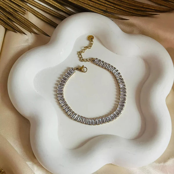 Curved flatlay of Korean style crystal tennis bracelet that is waterproof