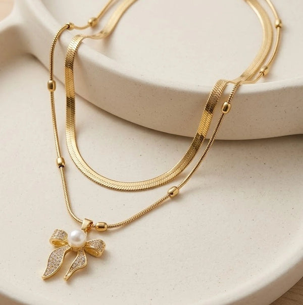 Layered bow and pearl pendant necklace in anti tarnish finish