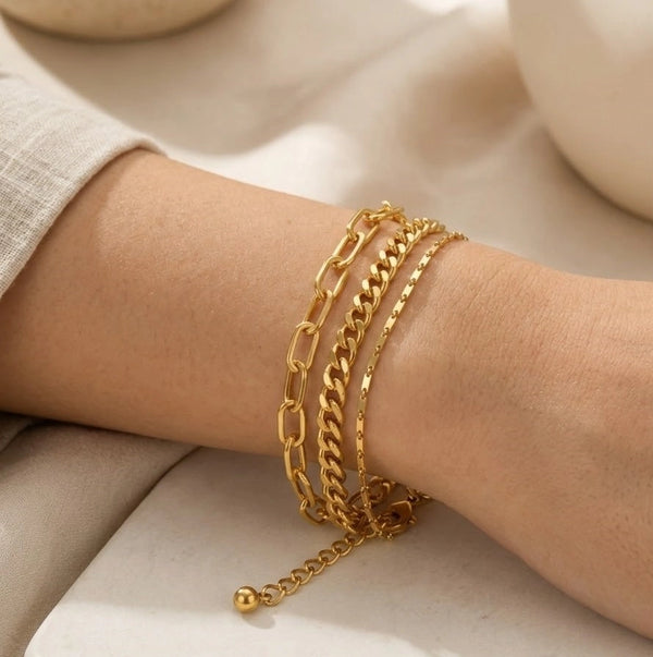 Model wearing 3-in-1 layered gold plated chain bracelet on wrist