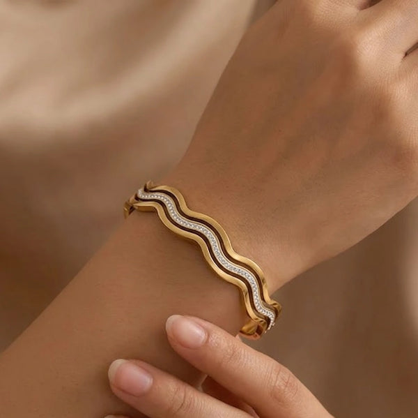 Close up details of the crystals and smooth curves on the wave bracelet