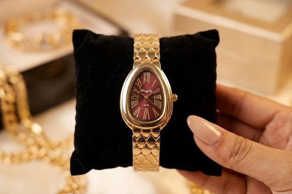 Flatlay of a minimalist style anti-tarnish gold plated watch.