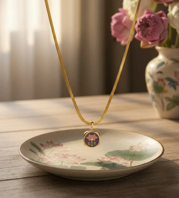 Minimalist square enamel pendant on a gold plated flat snake chain with a pearl accent flower detail.