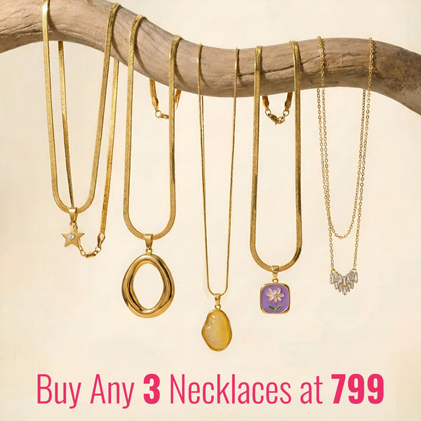 A beautiful stack of three gold-plated Korean-style necklaces from Moncheri, showing delicate pendant details