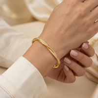 Twisted Infinity Gold Plated Bangle Bracelet