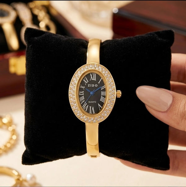 Front view of oval dial black crystal watch in anti-tarnish gold plated finish by Moncheri Jewels
