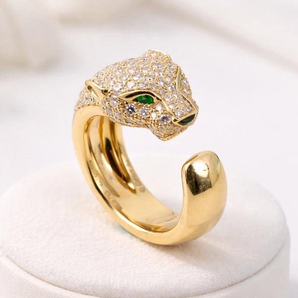 Gold pave panther head fashion ring front view with green eyes