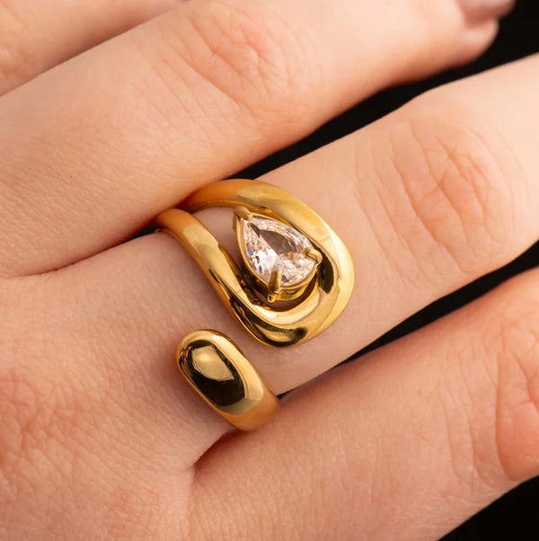 Front view of pear cut swirl adjustable ring with anti tarnish finish