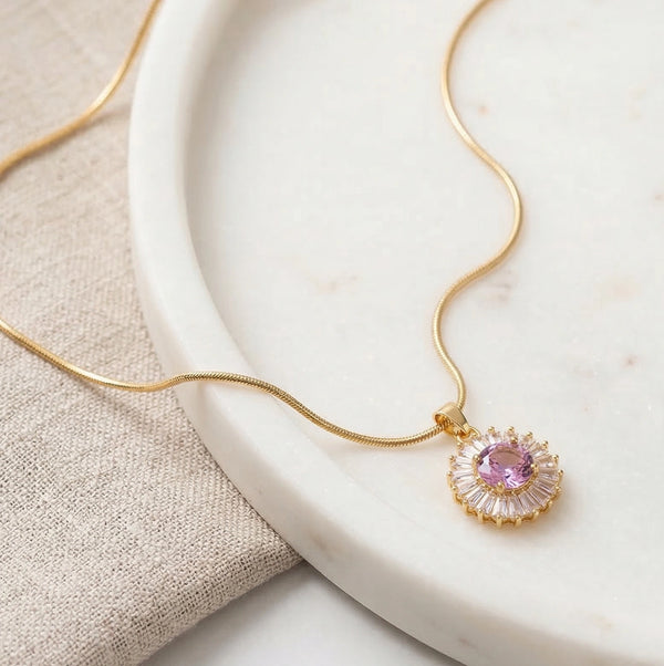 Front view of pink halo pendant anti-tarnish gold plated necklace