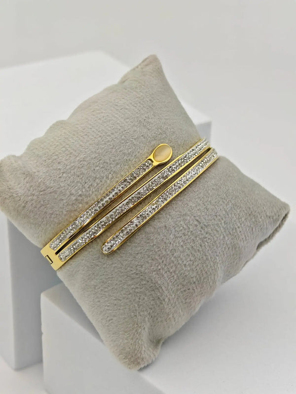 Close up of clear crystals on gold plated wrap bracelet