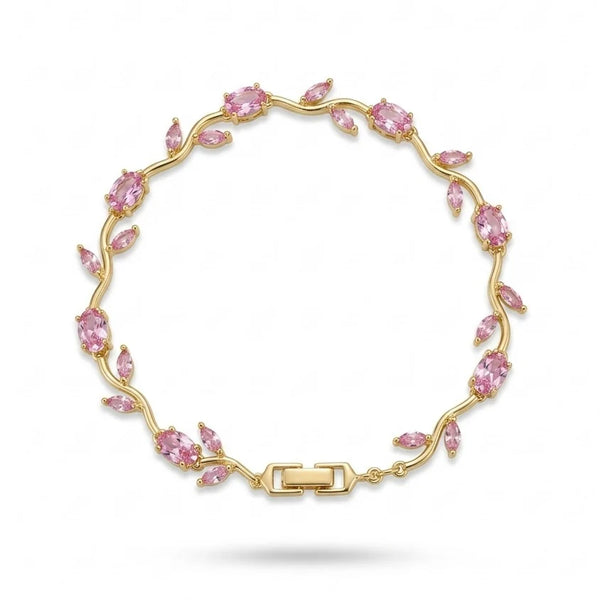 Close up detail of pink stones on gold toned vine bracelet