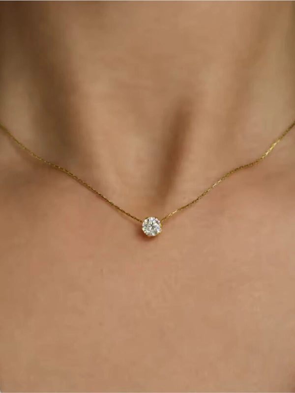 Woman wearing minimal solitaire pendant gold plated necklace