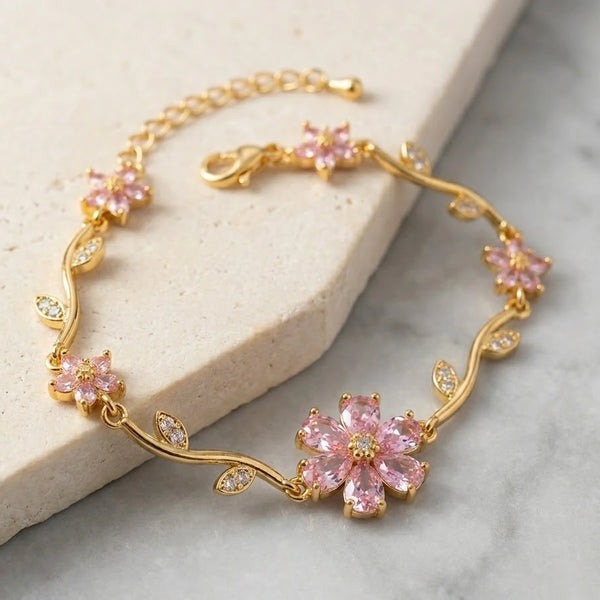 Angled view showcasing the clear stone leaves on the trendy floral anti-tarnish gold plated bracelet