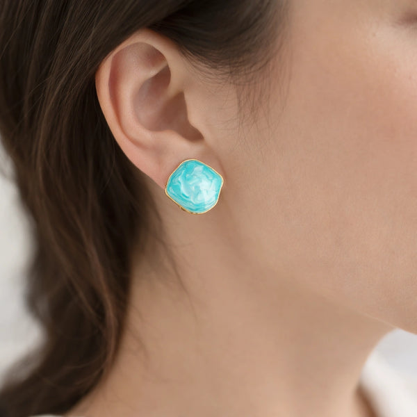Turquoise blue square stud earrings with gold rim front view