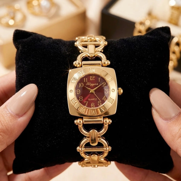 Front close up of vintage maroon dial watch featuring an anti-tarnish gold plated chain strap by moncheri Jewels