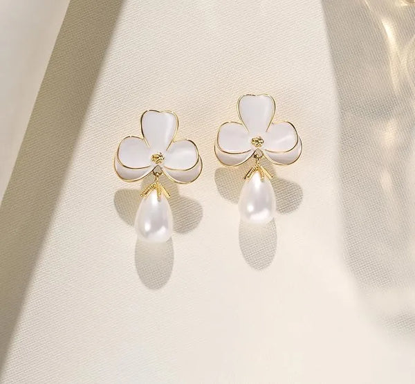 MONCHERI white enamel flower earrings with pear-shaped faux pearl drop.