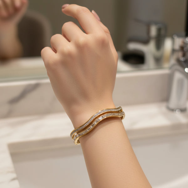 Woman Wearing Gold Plated Wave Bracelet on Wrist Fashion Jewellery Styling