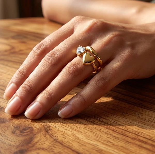 Woman wearing water resistant gold plated dual heart ring on her finger