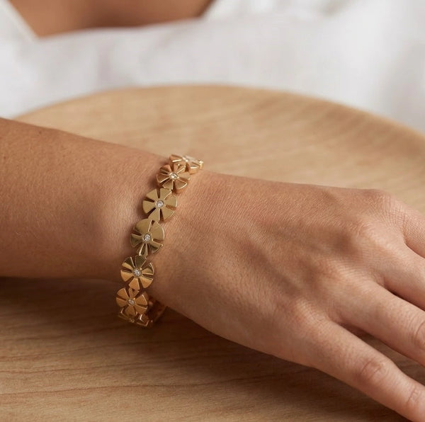 Side angle showing the sleek design of the gold plated floral bracelet