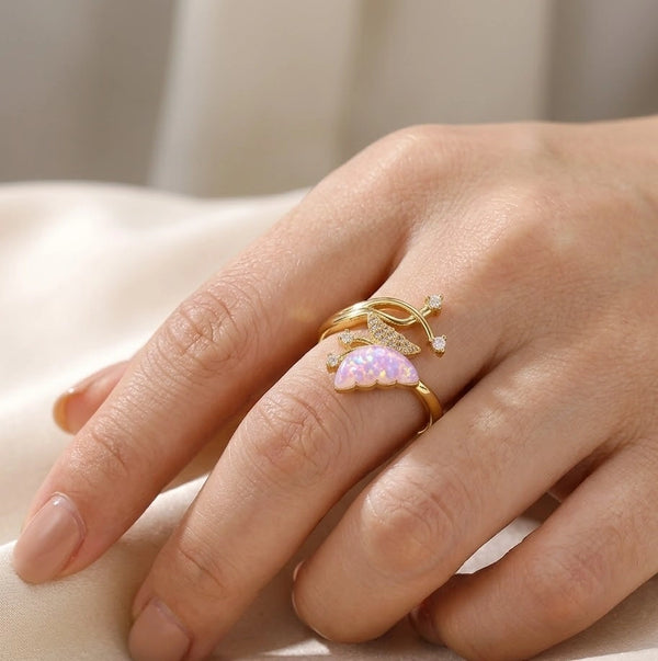 Woman wearing the minimalist gold-plated fairycore butterfly ring on her finger